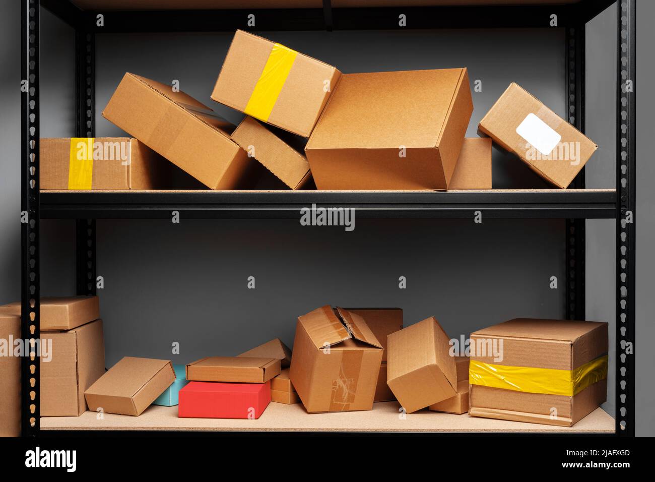 Rows of shelves with cardboard boxes in modern warehouse Stock Photo ...