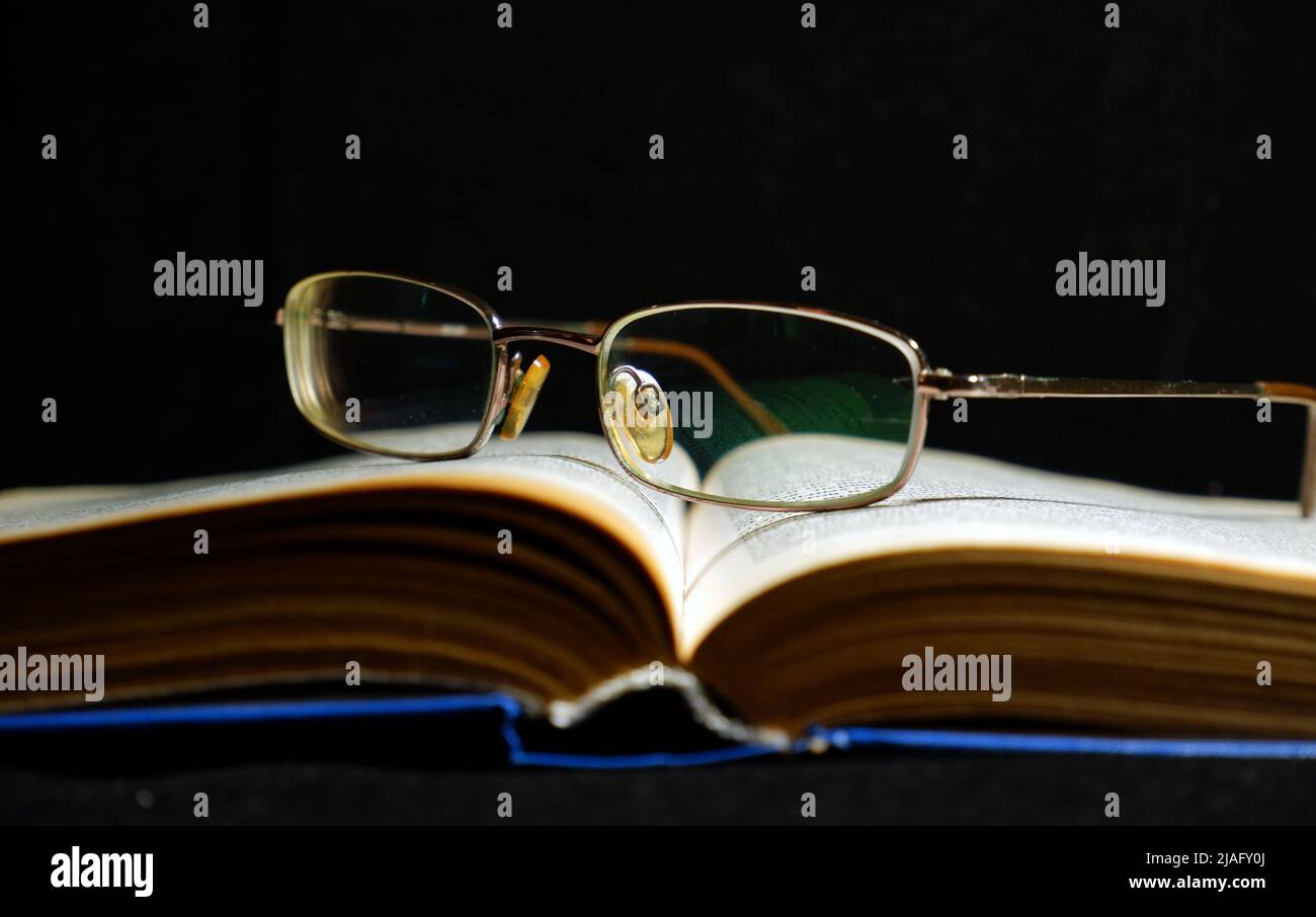 open old book on dark background Stock Photo