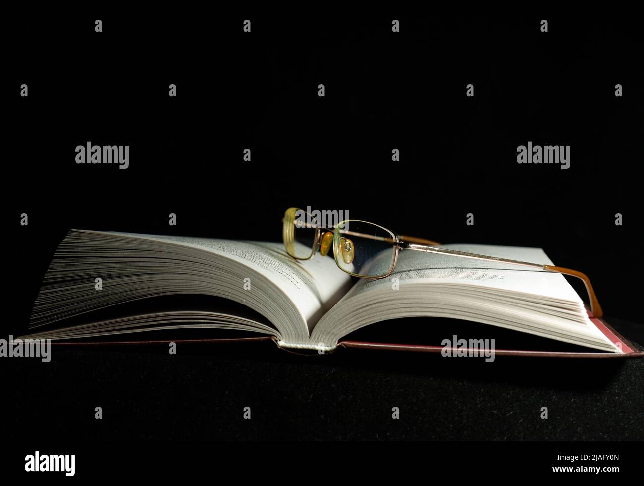 open old book on dark background Stock Photo