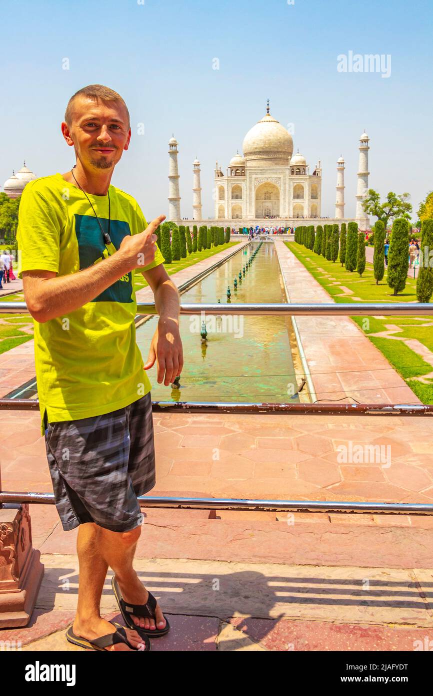Traveler and tourist poses in front of the famous Taj Mahal in Agra India Mogul marble mausoleum and panorama of the famous 17th century symmetrical g Stock Photo - Alamy Traveler and tourist poses in front of the famous Taj Mahal in Agra India Mogul marble mausoleum and panorama of the famous 17th century symmetrical g Stock Photo - Alamy