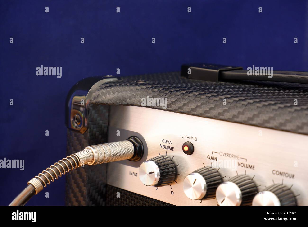 Guitar amplifier and control knobs close up Stock Photo