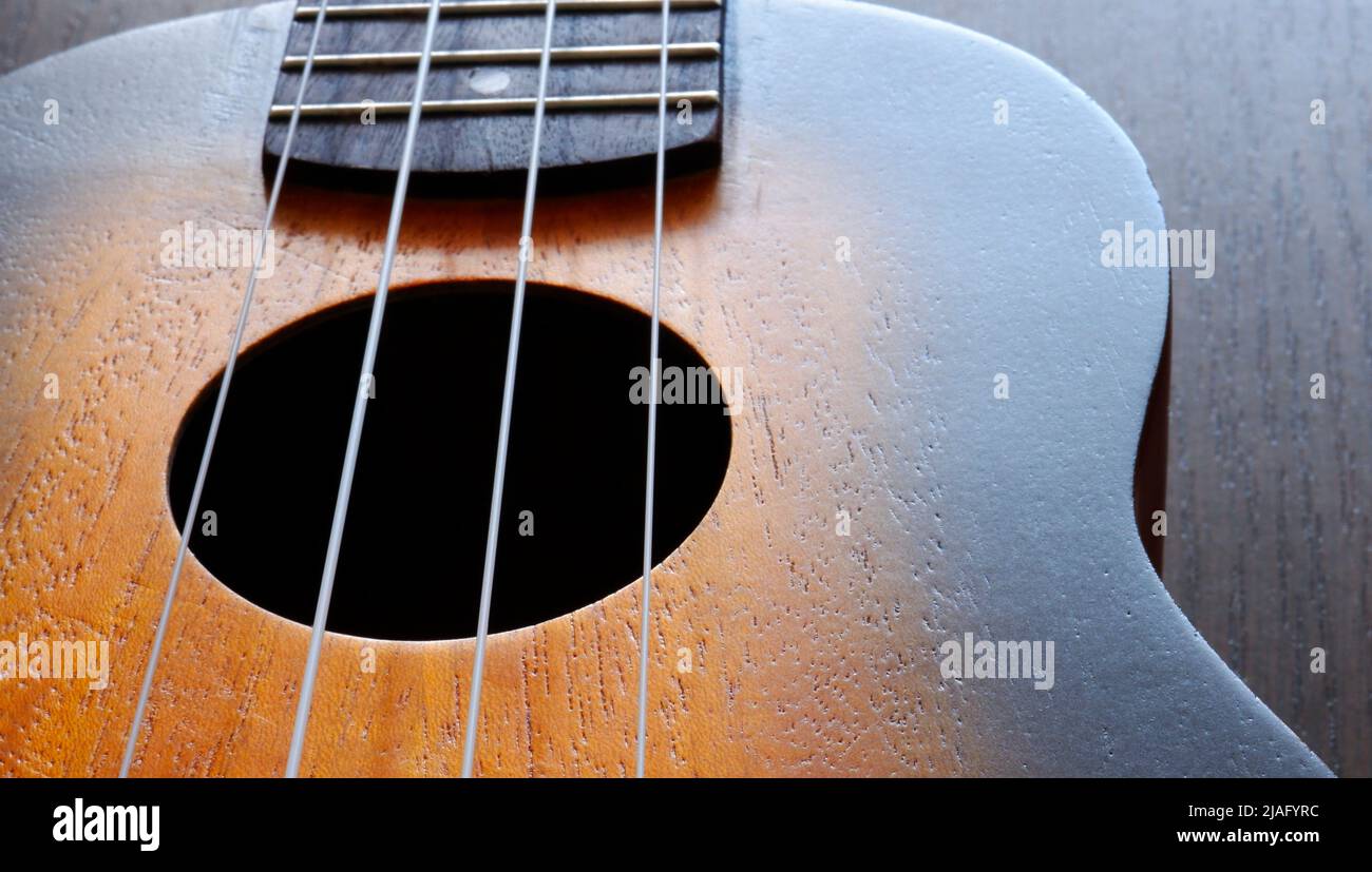 Ukulele soundboard, strings and fretboard close up Stock Photo Alamy
