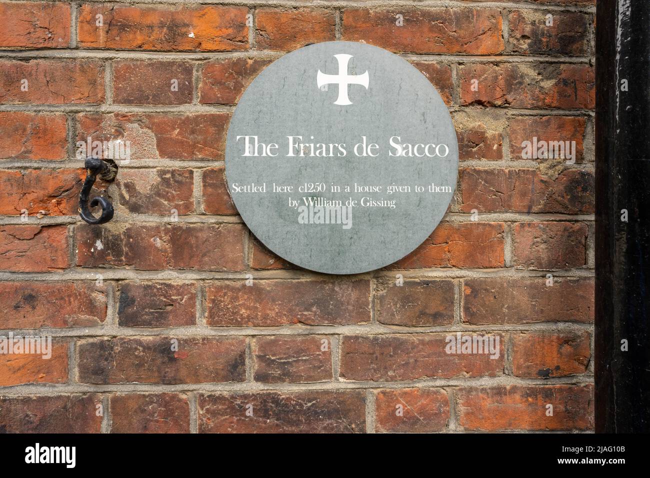 The Friars De Sacco round plaque on a wall in Norwich city Stock Photo
