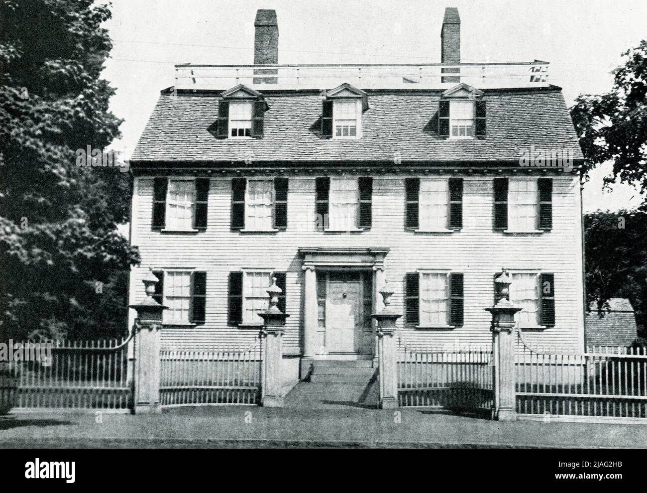 The 1920 caption reads: 'Ropes House 1719 Salem, Massachusetts.' The Ropes Mansion, also called Ropes Memorial, is a Georgian Colonial mansion located at 318 Essex Street, located in the McIntire Historic District in Salem, Massachusetts. It is now operated by the Peabody Essex Museum and open to the public. The house was built for Samuel Barnard, a merchant. Stock Photo