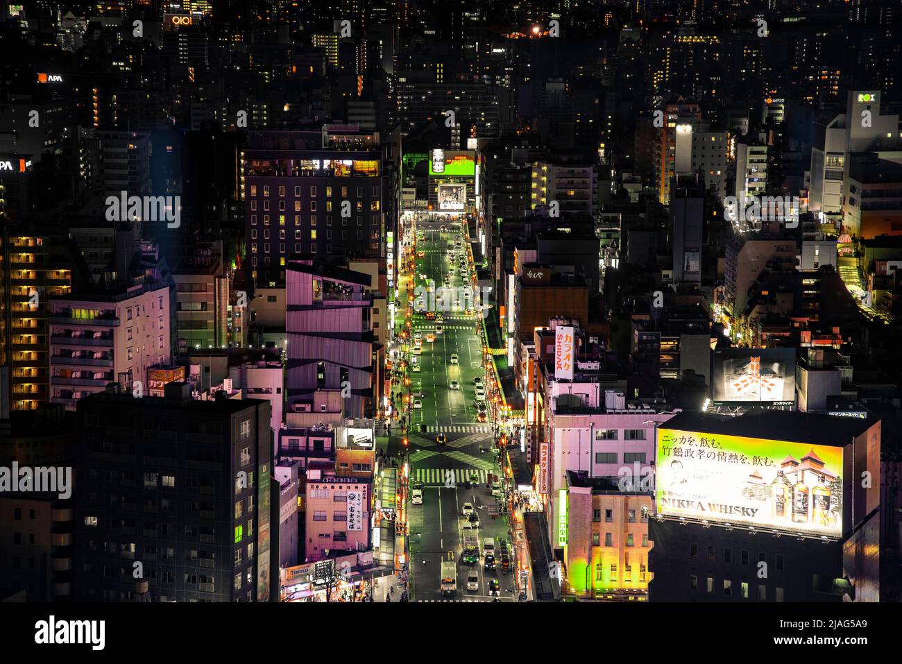 bird view of street in Tokyo Japan at night with bright street lights Stock Photo