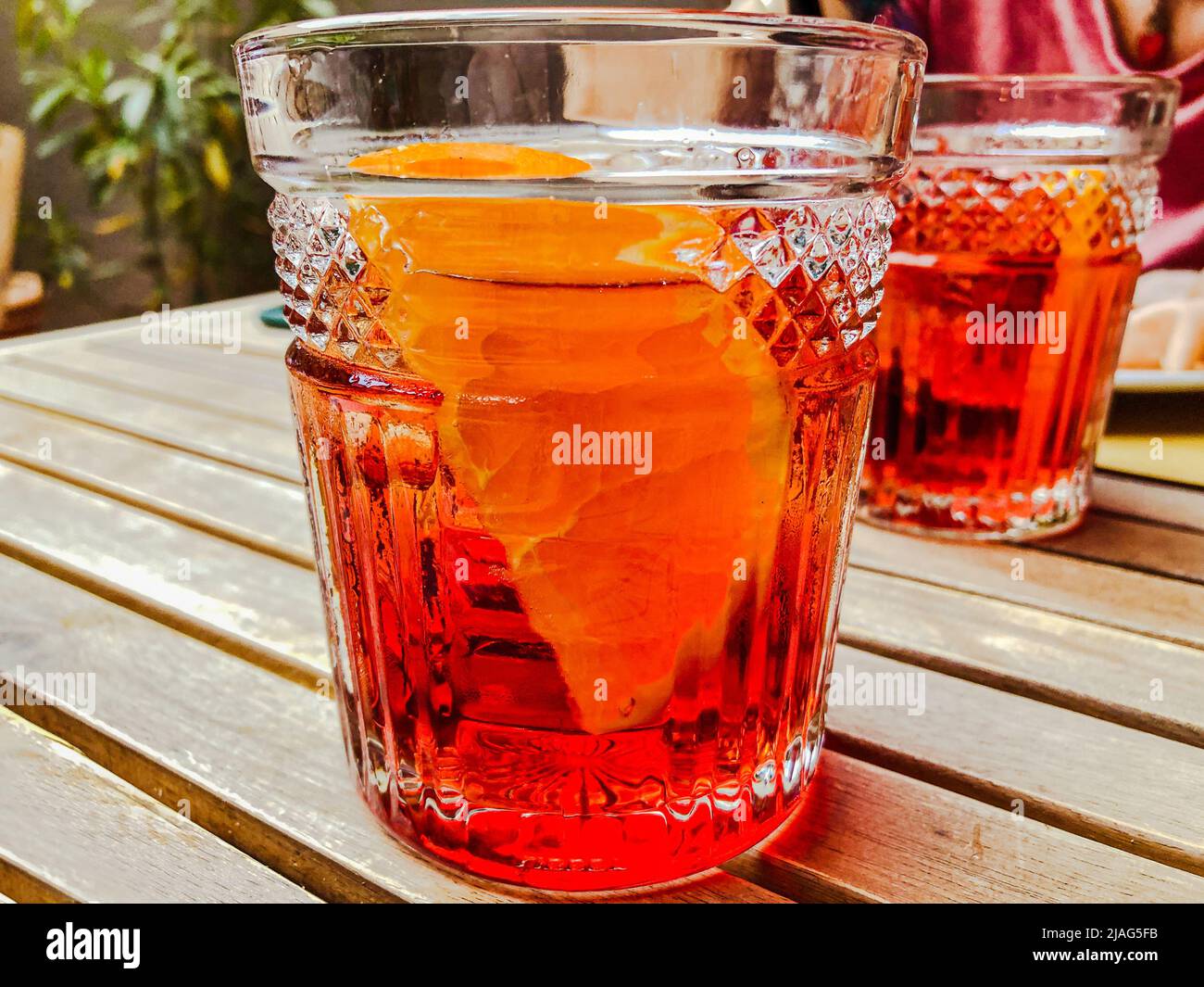 Close up shot of a red cocktail with Ice and Orange Slice. Americano cocktail, Negroni cocktail, Spritz cocktail. Stock Photo