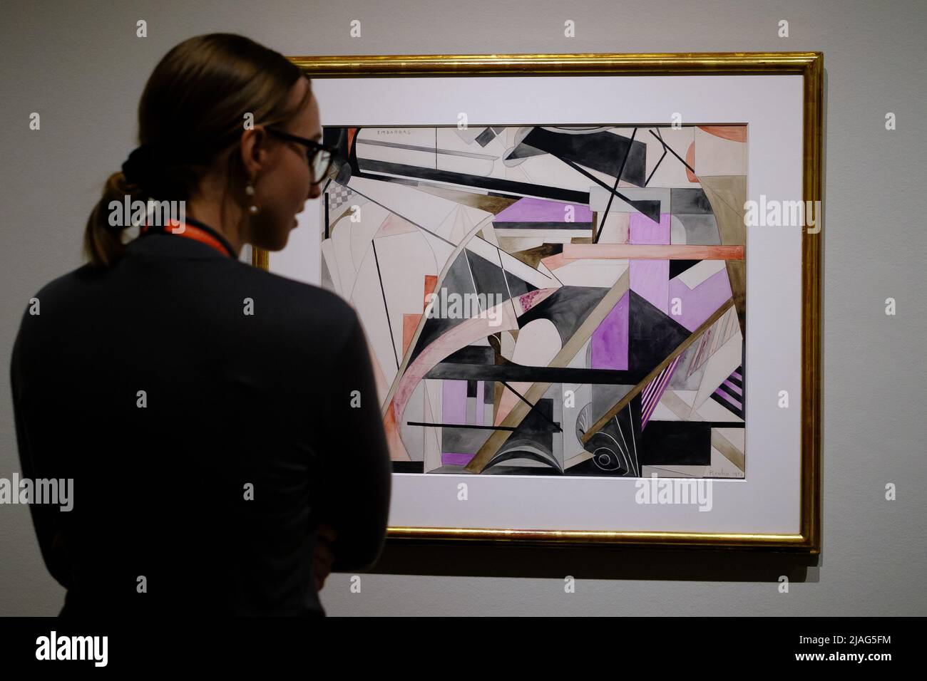 A woman looks at the painting Francis Picabia during the exhibition 'Artist Letters in the Anne-Marie Springer Collection' at the Museo Nacional Thyssen-Bornemisza in Madrid. The Thyssen-Bornemisza National Museum presents, for the first time in Spain, a selection of letters and postcards written by painters such as Delacroix, Manet, Degas, Monet, Cézanne, Van Gogh, Gauguin, Matisse, Juan Gris, Frida Kahlo or Lucian Freud, belonging to the Anne-Marie Springer collection, in dialogue with works by these and other artists in the permanent collection. Stock Photo