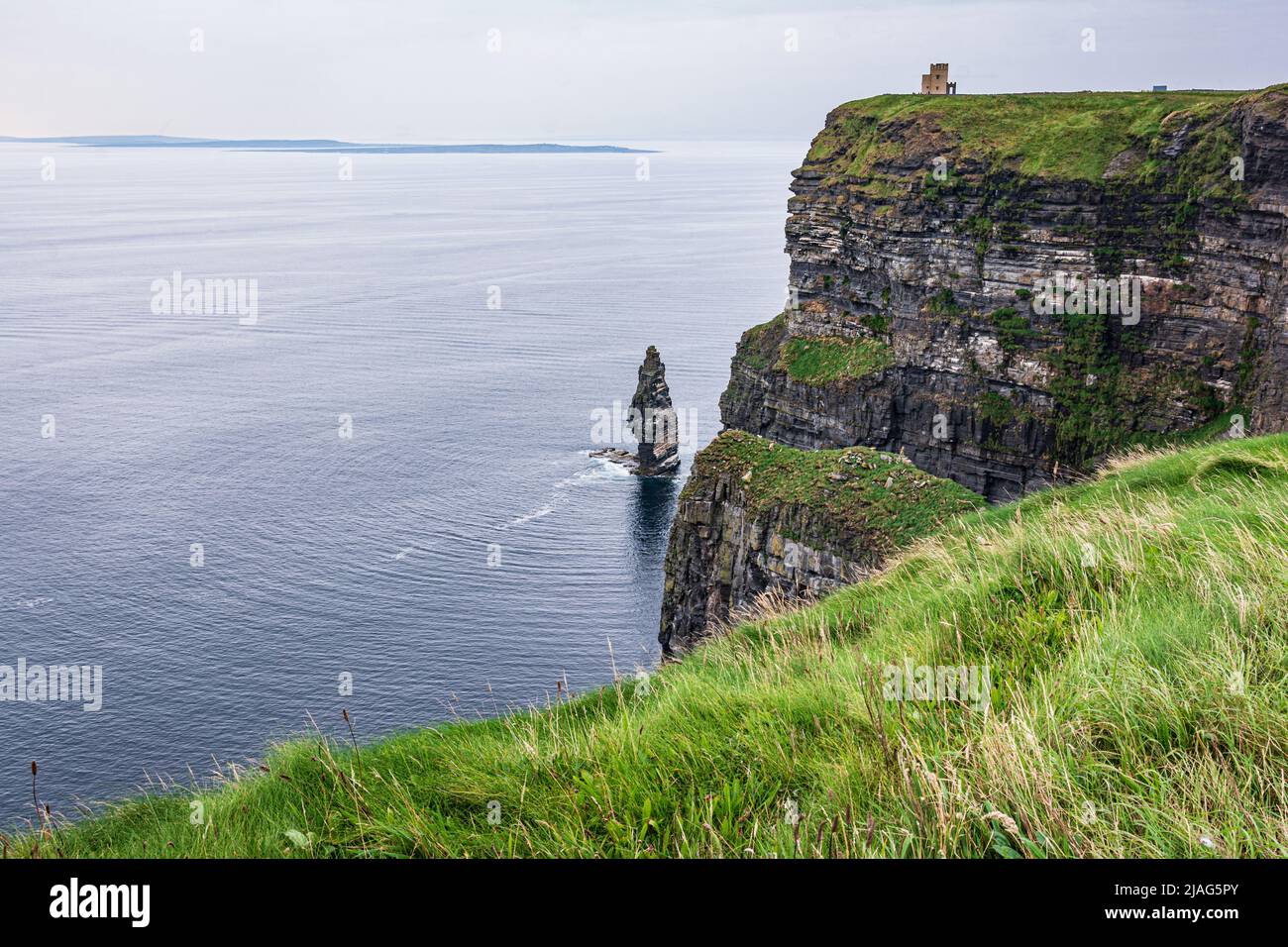 View of a rock in front of Cliffs of Moher, County Clare, Ireland Stock Photo