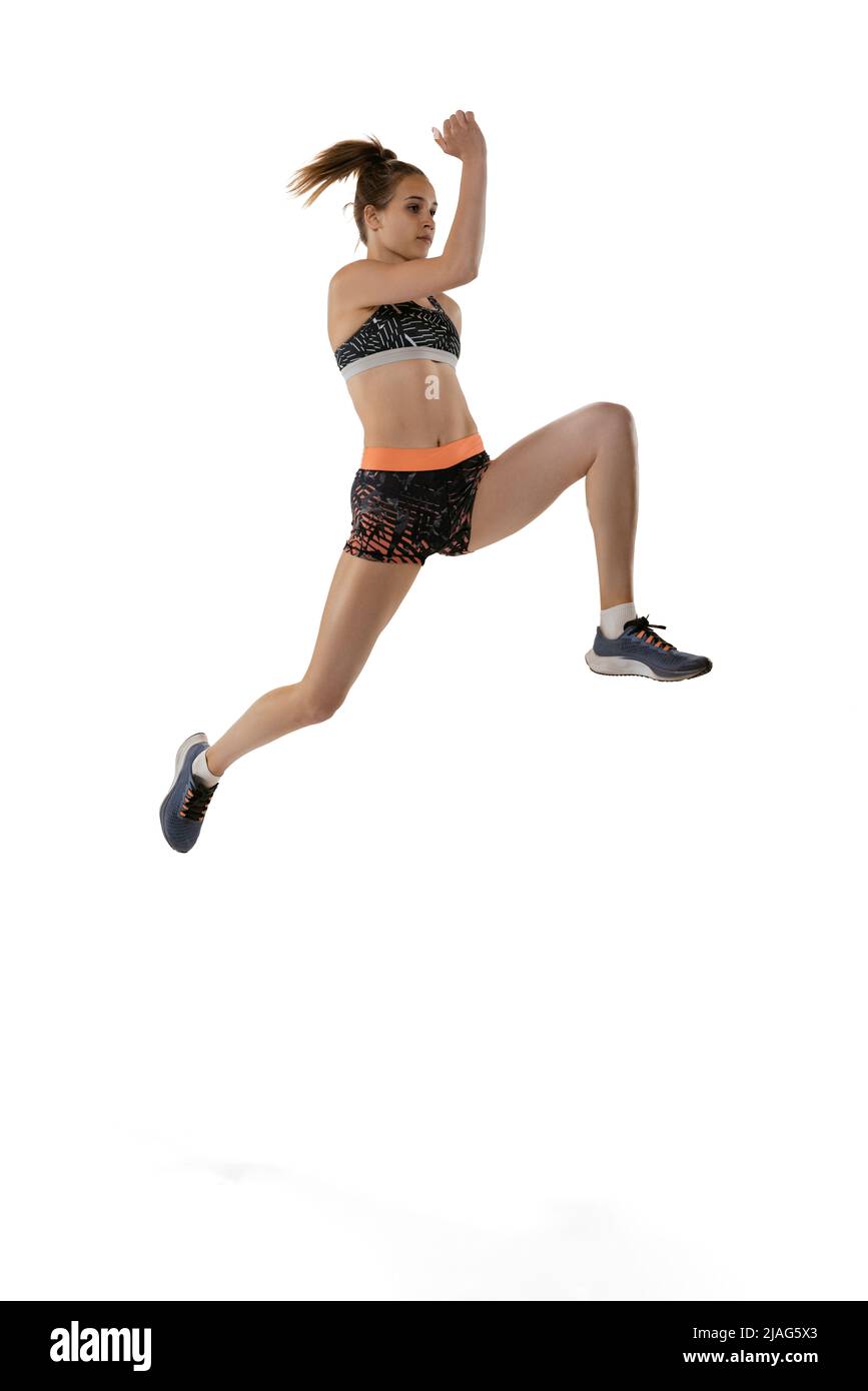 Long jump technique. Studio shot of professional female athlete in
