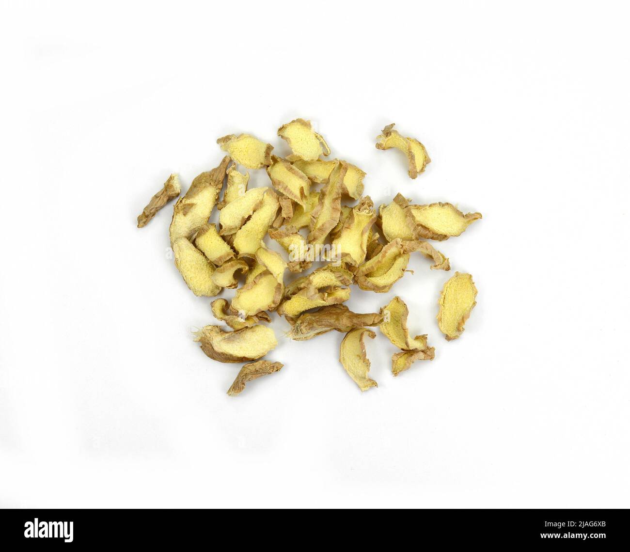 pile of dried ginger slices isolated on white background Stock Photo