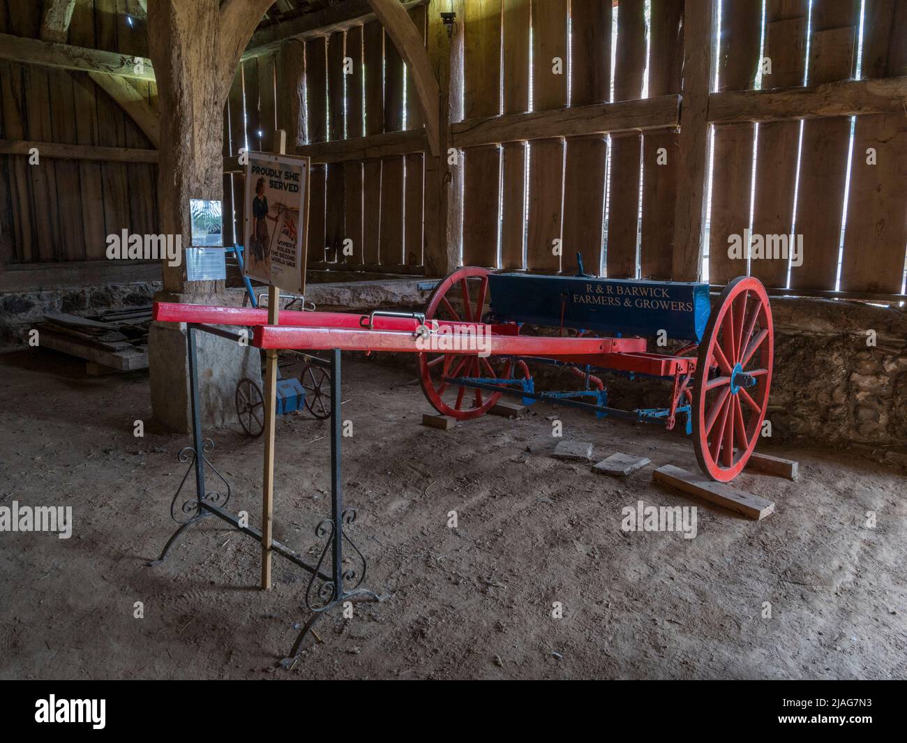Single horse seed drill (c 1925) on display inside the Harmondsworth Great Barn (also known as Manor Farm Barn, Harmondsworth, London, UK. Stock Photo