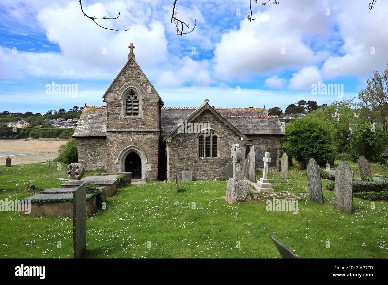 St. Michaels Church at Porthilly and the Medieval Cross. Stock Photo