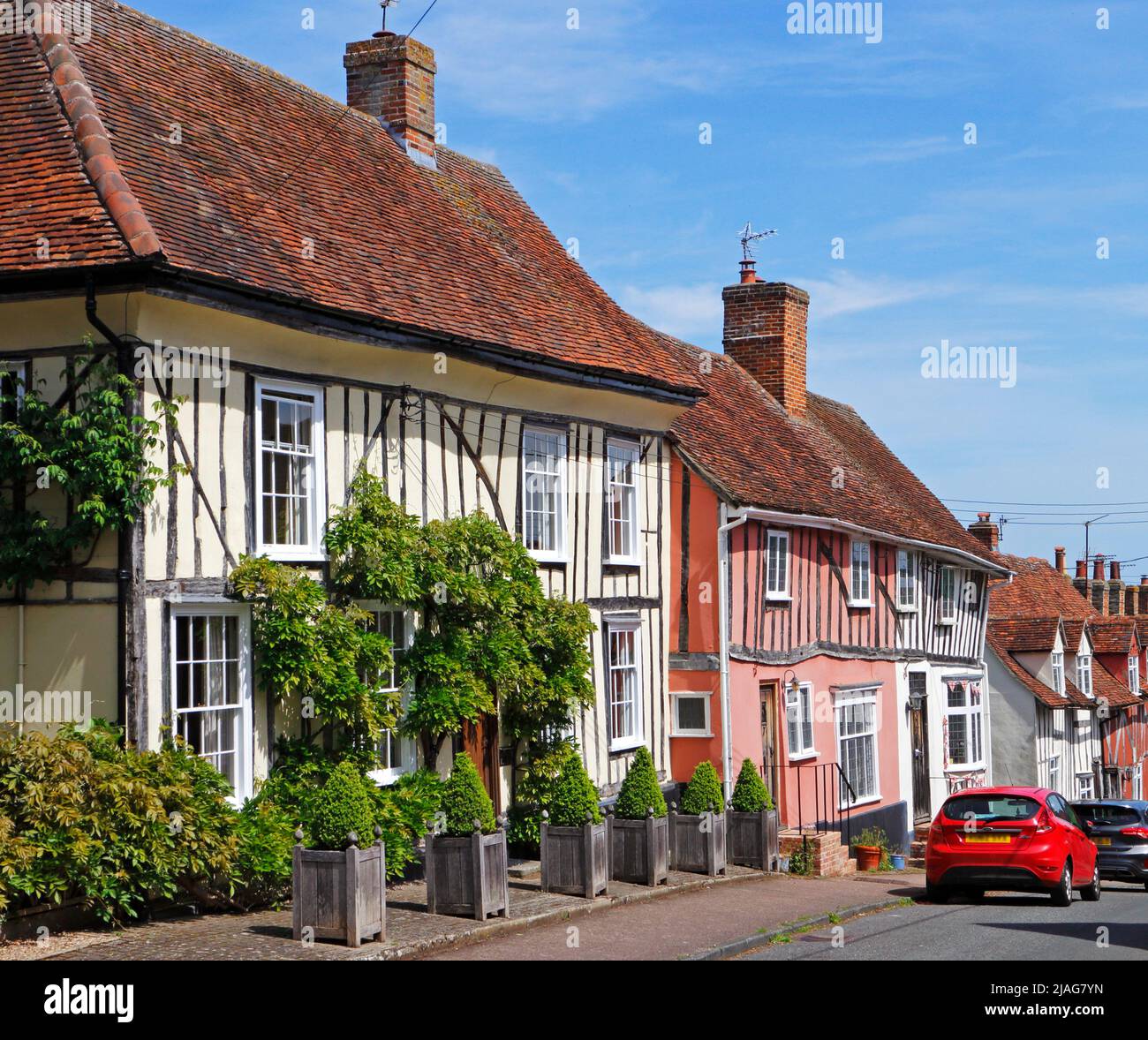 A street of well preserved half-timbered and plaster houses in the former 'wool town' of Lavenham, Suffolk, England, United Kingdom. Stock Photo