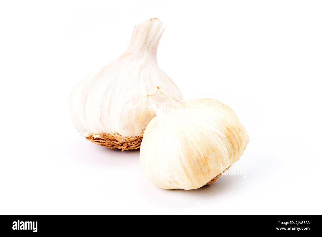 Two heads of garlic on a white background. Vegetarian food. Ecological food Stock Photo