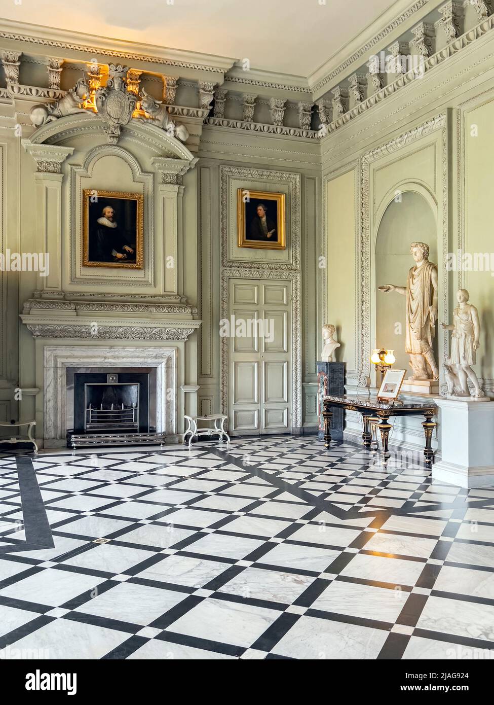 The Marble Hall at Petworth House in West Sussex, United Kingdom.  Petworth is a late 17th-century Grade I listed country house, rebuilt in 1688 by Ch Stock Photo
