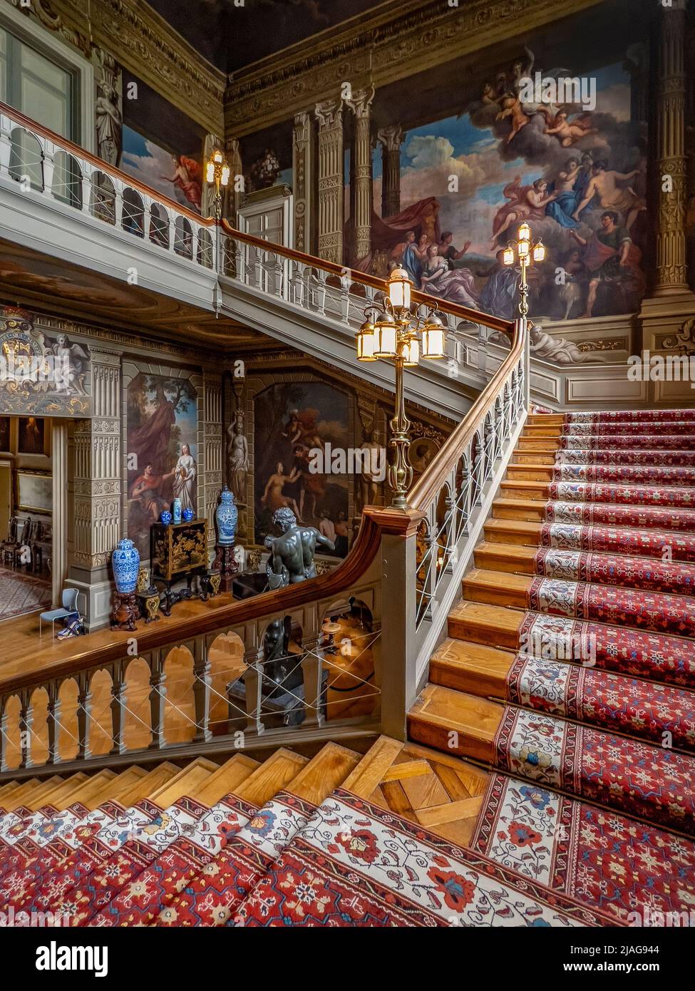 The Grand Staircase at Petworth House in West Sussex, United Kingdom.  Petworth is a late 17th-century Grade I listed country house, rebuilt in 1688 b Stock Photo