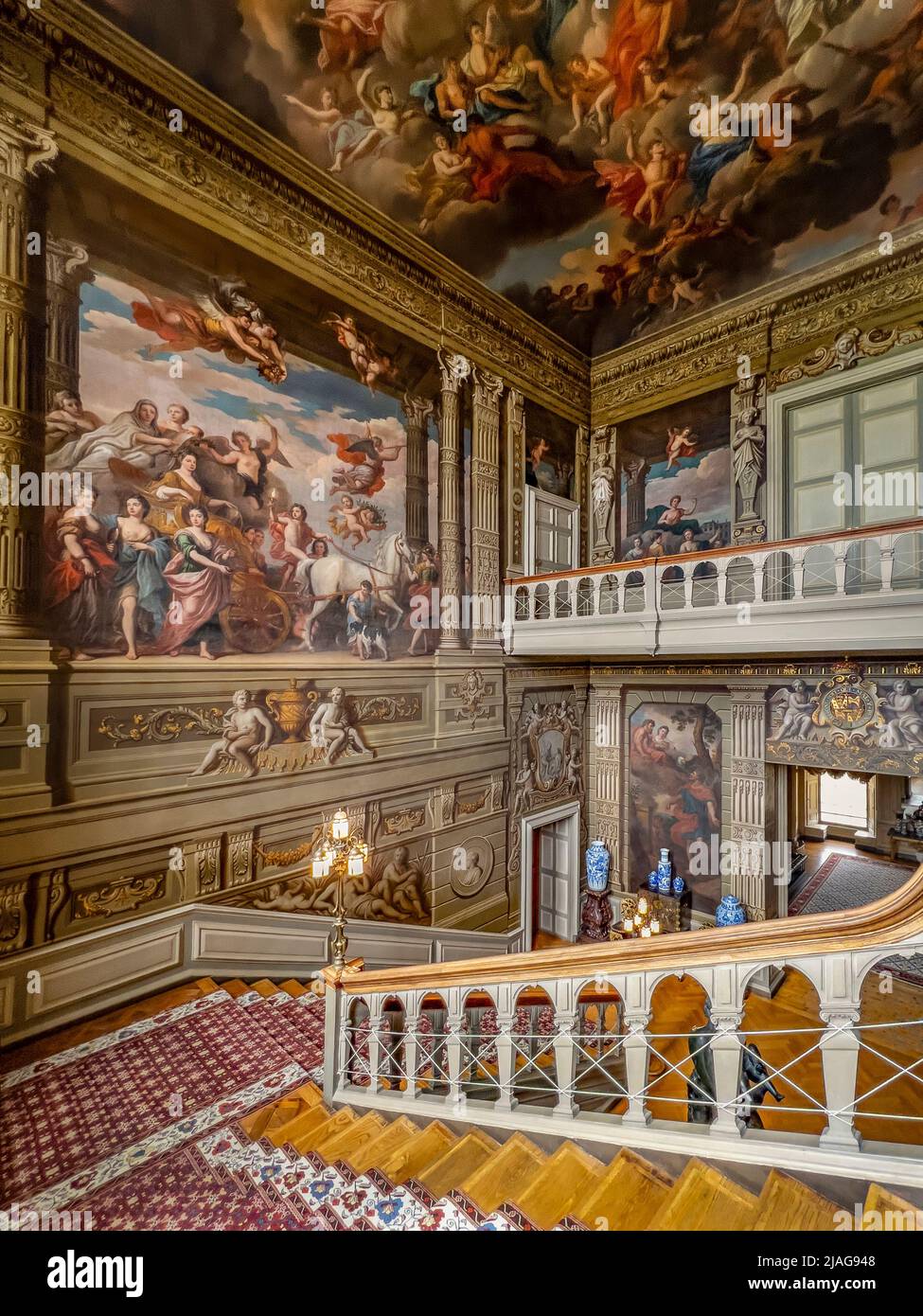The Grand Staircase at Petworth House in West Sussex, United Kingdom.  Petworth is a late 17th-century Grade I listed country house, rebuilt in 1688 b Stock Photo