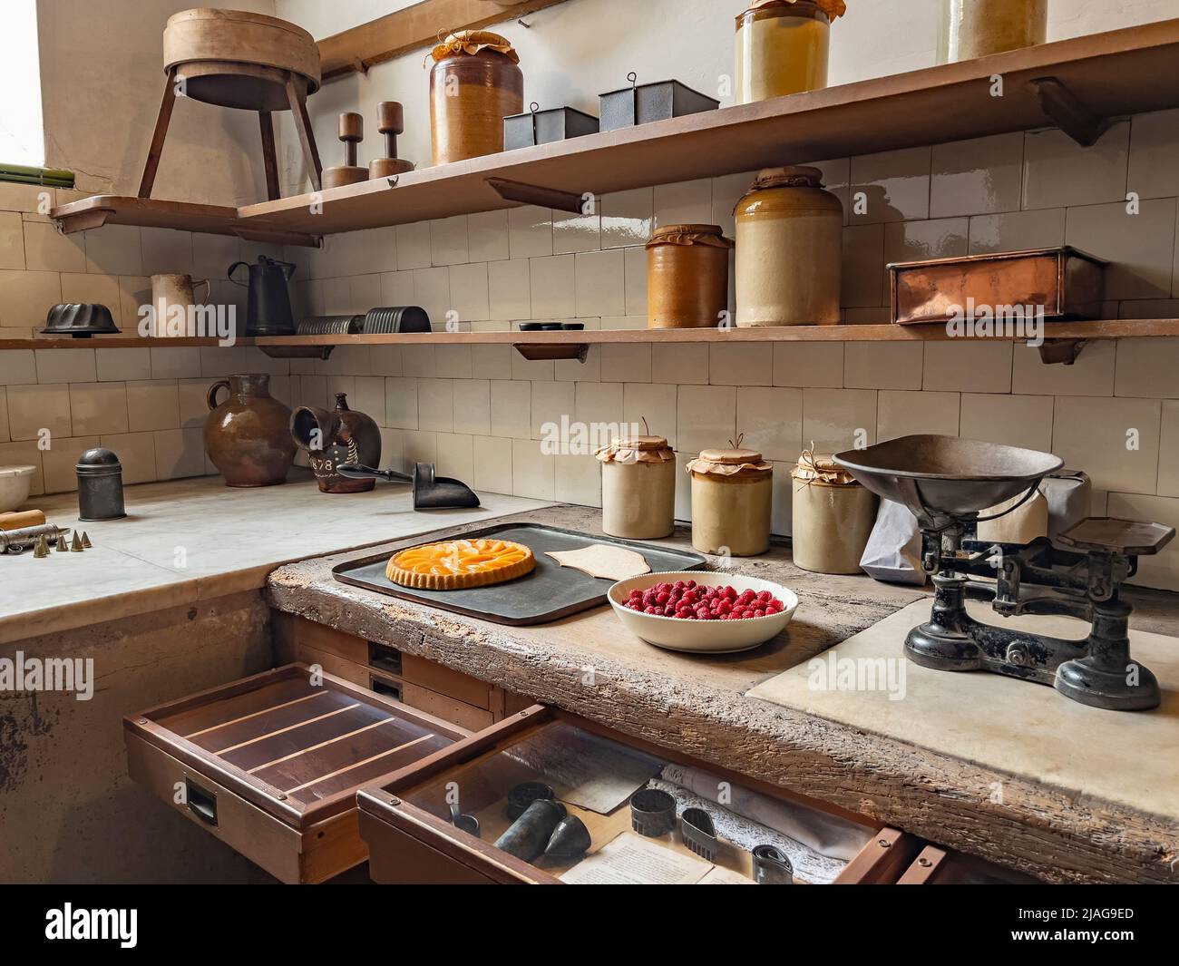 The pastry room in the 18th Century Kitchen at Petworth House in West Sussex, United Kingdom.  Petworth is a late 17th-century Grade I listed country Stock Photo