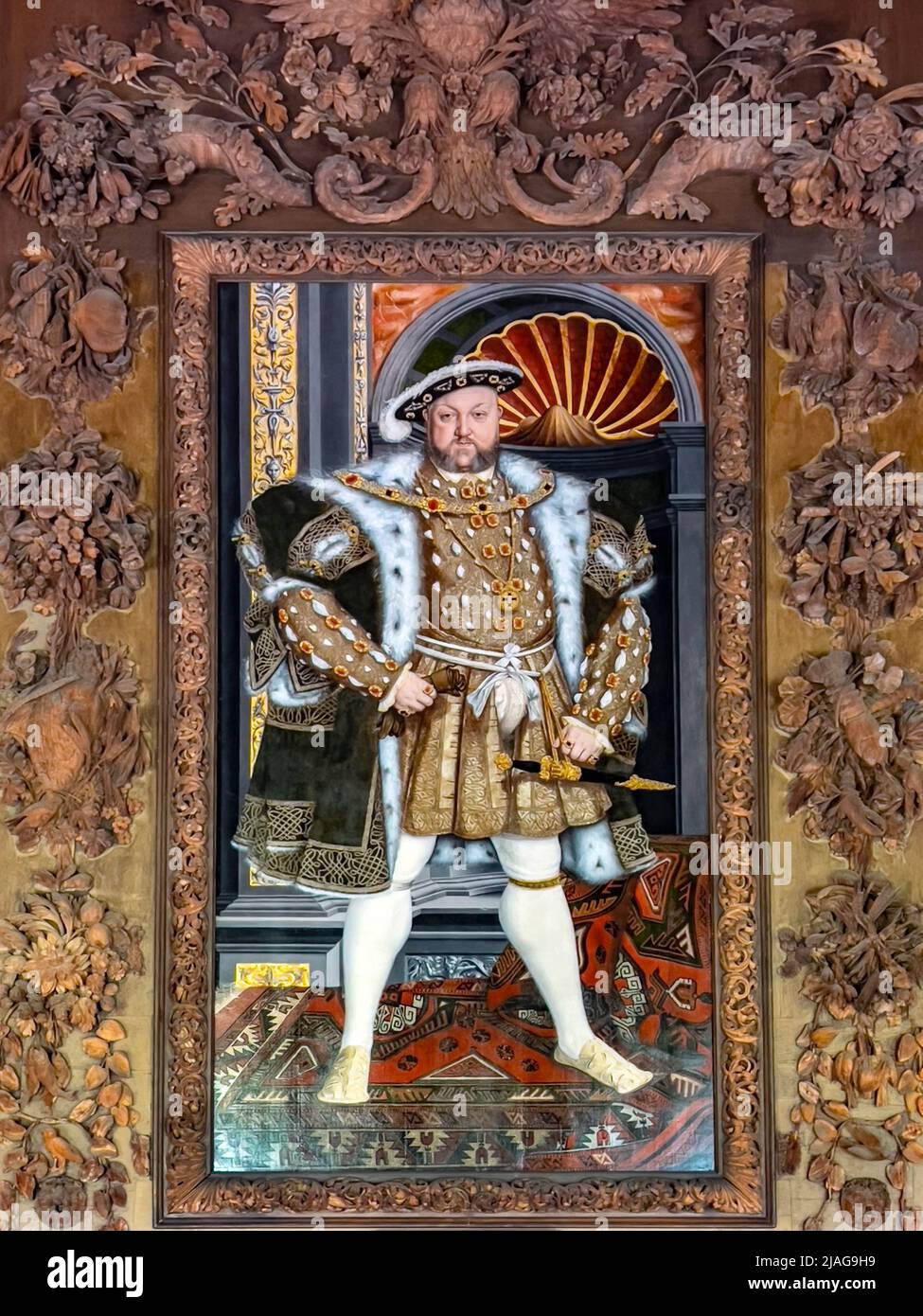King Henry the VIII in the Carved Room at Petworth House in West Sussex, United Kingdom.  Petworth is a late 17th-century Grade I listed country house Stock Photo