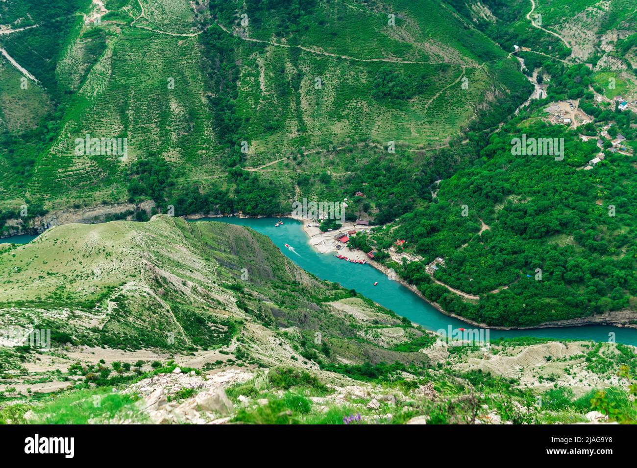 top view of the mountain river Sulak in Dagestan with a tourist boat base Stock Photo