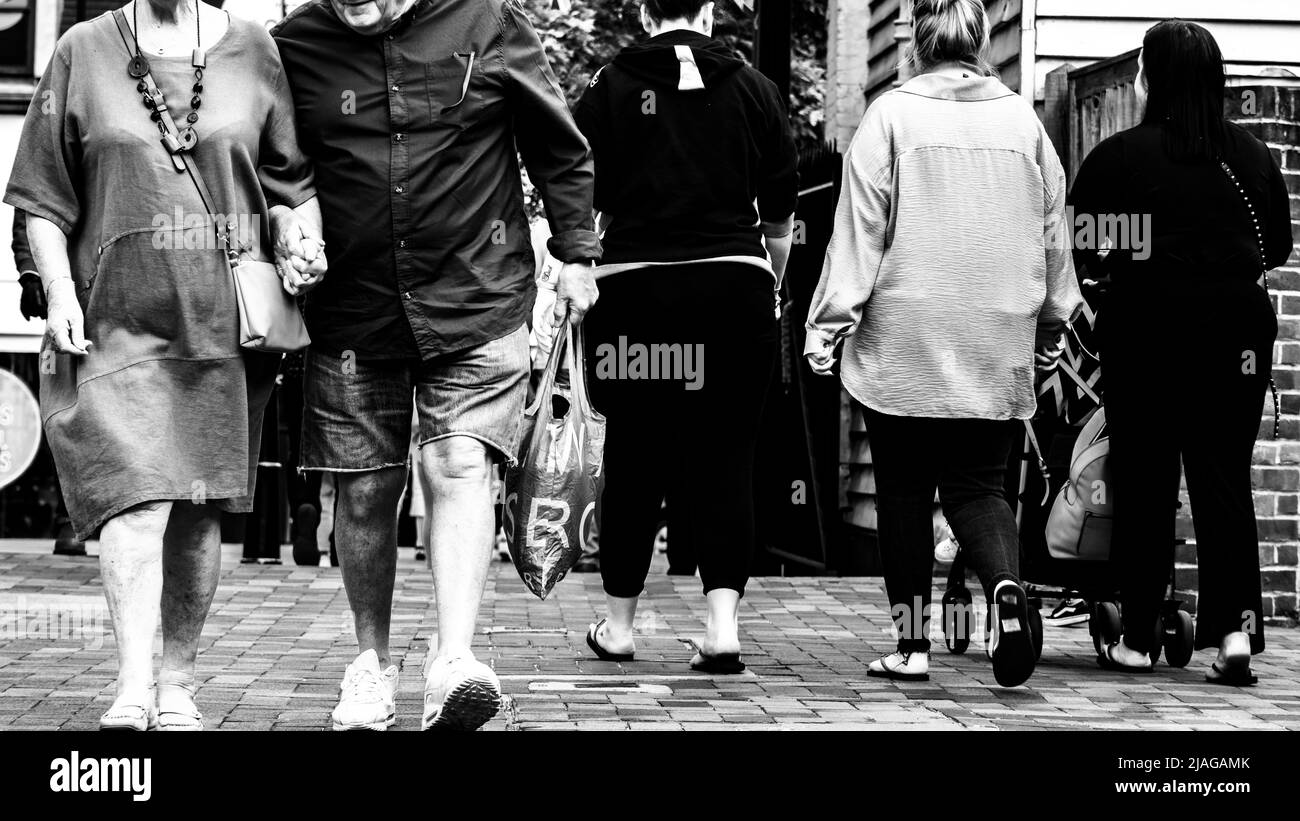 Epsom Surrey, London UK, May 28 2022, Small Group Of People Walking Along High Street Stock Photo