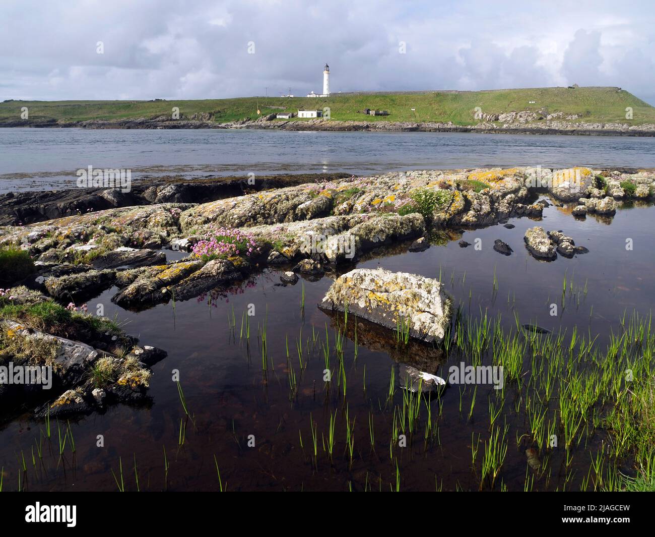 Orsay island and lighthouse from Port Wemyss, Rinns of Islay Stock Photo