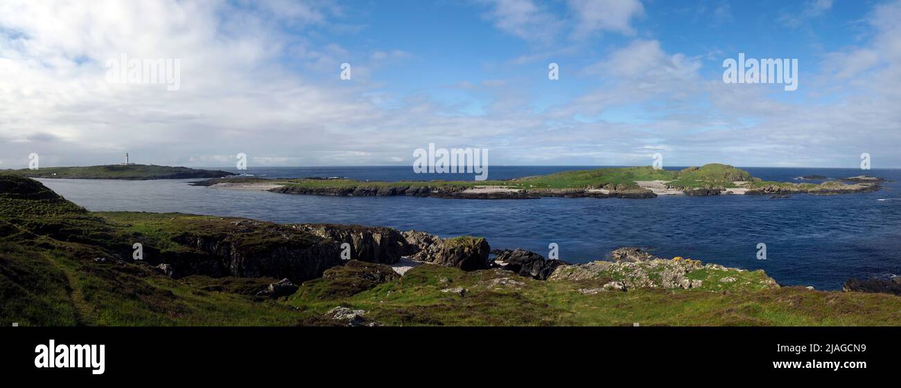 Orsay island and lighthouse, Eilean Mhic Coinnich from Portnahaven, Rinns of Islay, Scotland Stock Photo