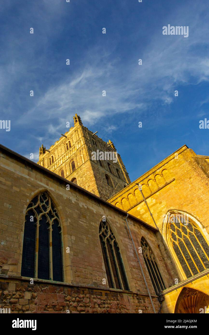 Exterior view of Tewkesbury Abbey a medieval building in Gloucestershire England UK with blue sky behind. Stock Photo