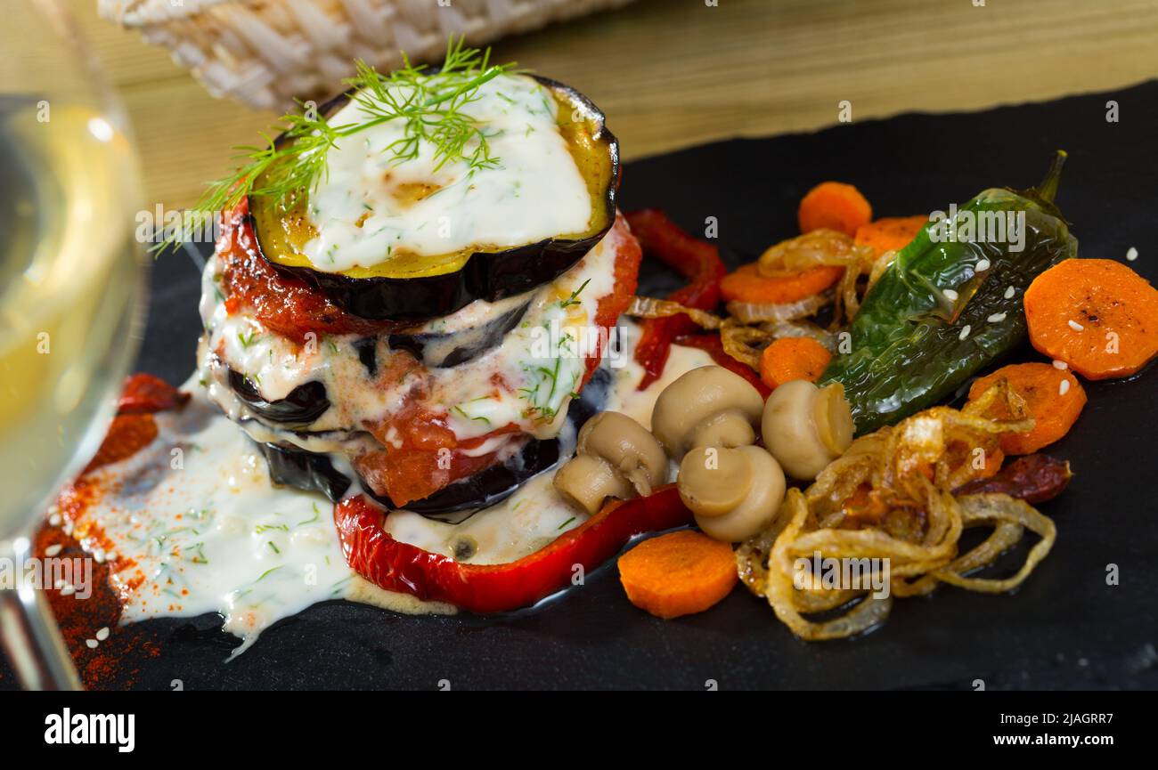 Eggplant pyramid dressed with garlic yoghurt sauce Stock Photo Alamy