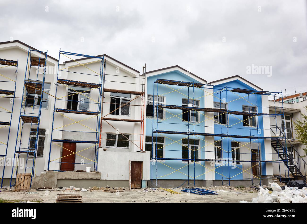 The progress of construction of the kindergarten building. Modern