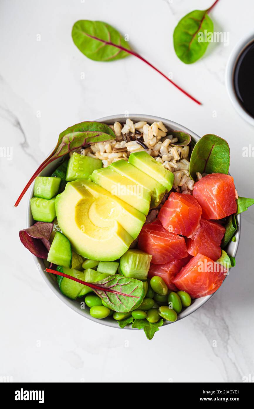 Healthy version of Hawaiian poke brown rice, salmon, edamame