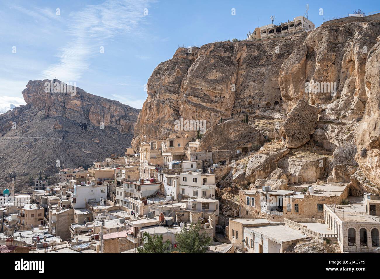 The town of Maaloula located in south Syria was built into the ragged mountainside. Stock Photo