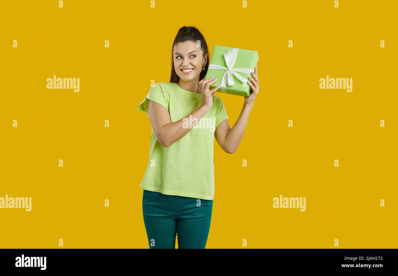 Excited woman hold gift box in hands Stock Photo