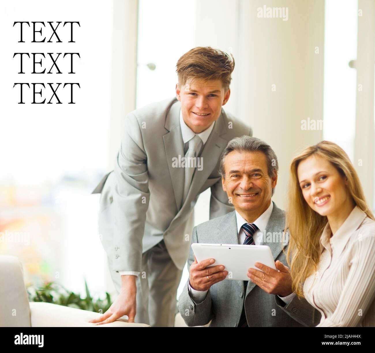 serious business team with tablet pc computers, documents having discussion in office Stock Photo