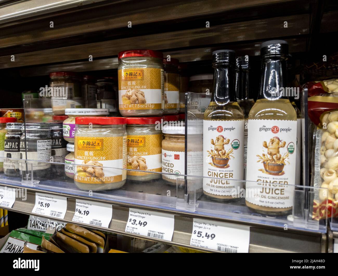 Mill Creek, WA USA - circa May 2022: Angled view of preserved ginger and black garlic for sale inside a Town and Country grocery store. Stock Photo