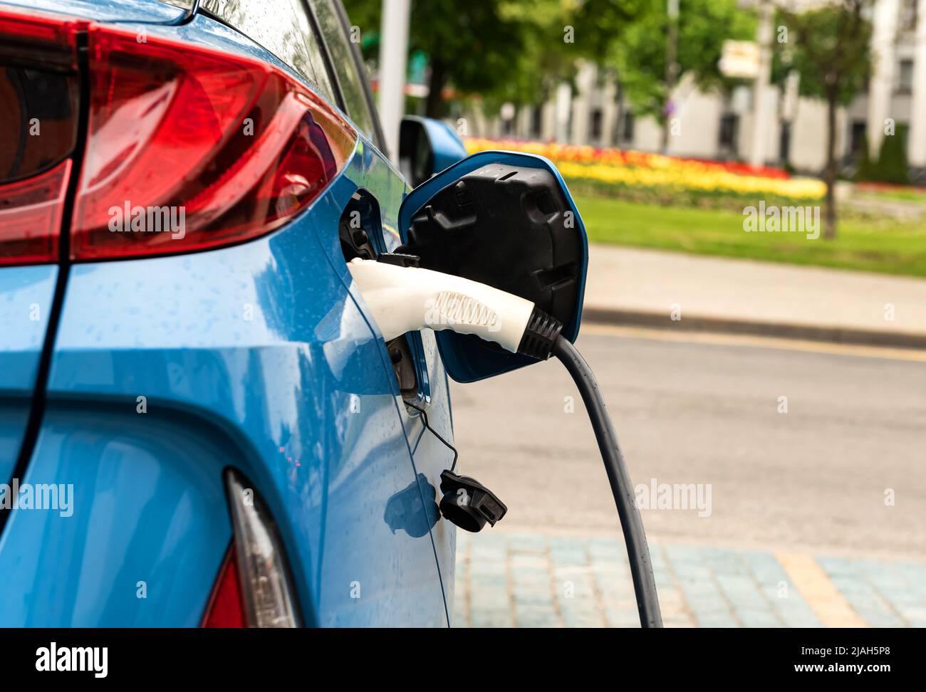 Electric car at the charging station. Ecology. Eco-friendly transport ...