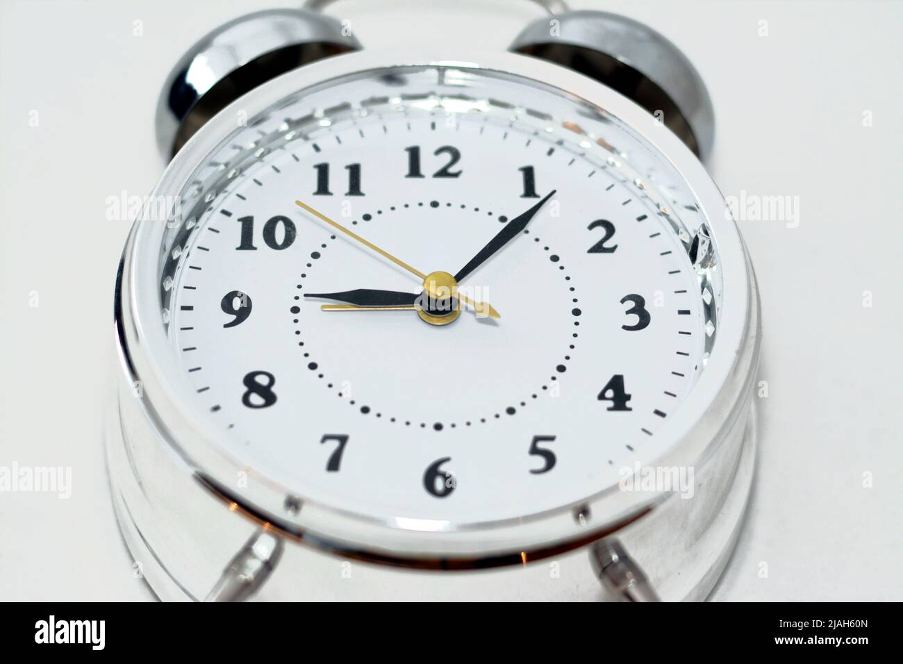 Sliver alarm clock isolated on white background, a vintage retro old