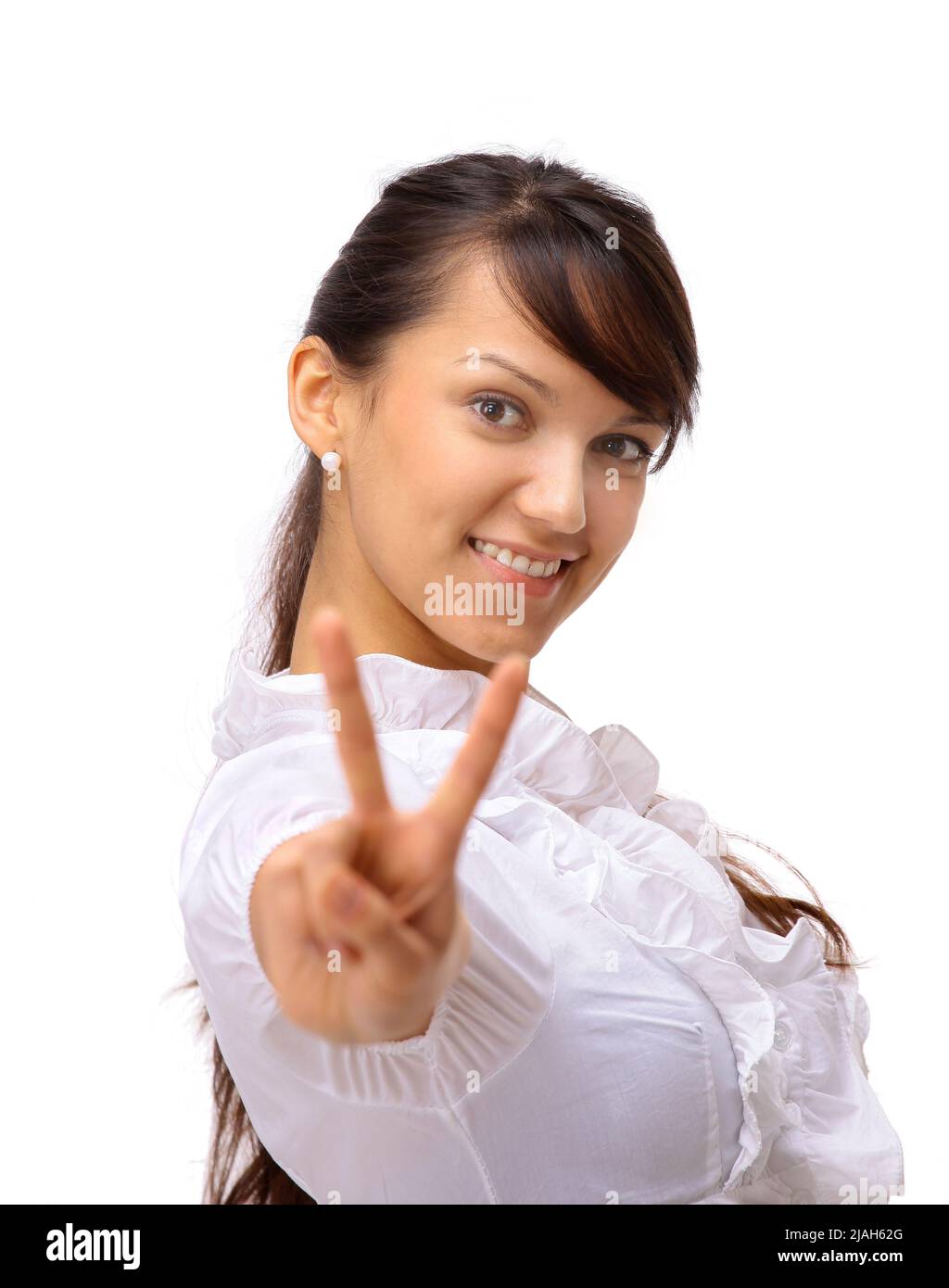 The beautiful business woman shows a symbol on a white background Stock