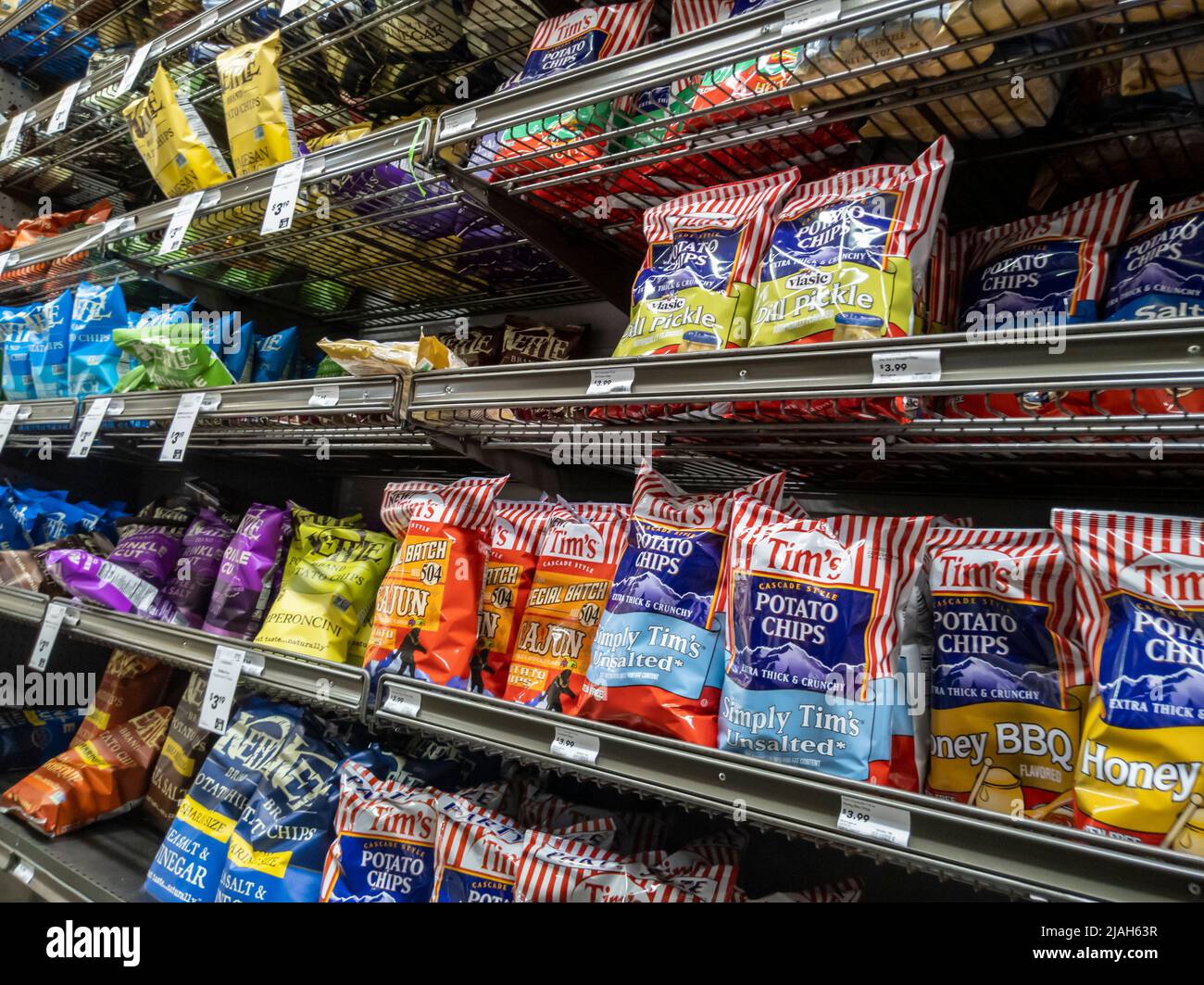 Mill Creek, WA USA - circa May 2022: Angled view of Tim's and Kettle brand potato chips for sale inside a Town and Country market. Stock Photo