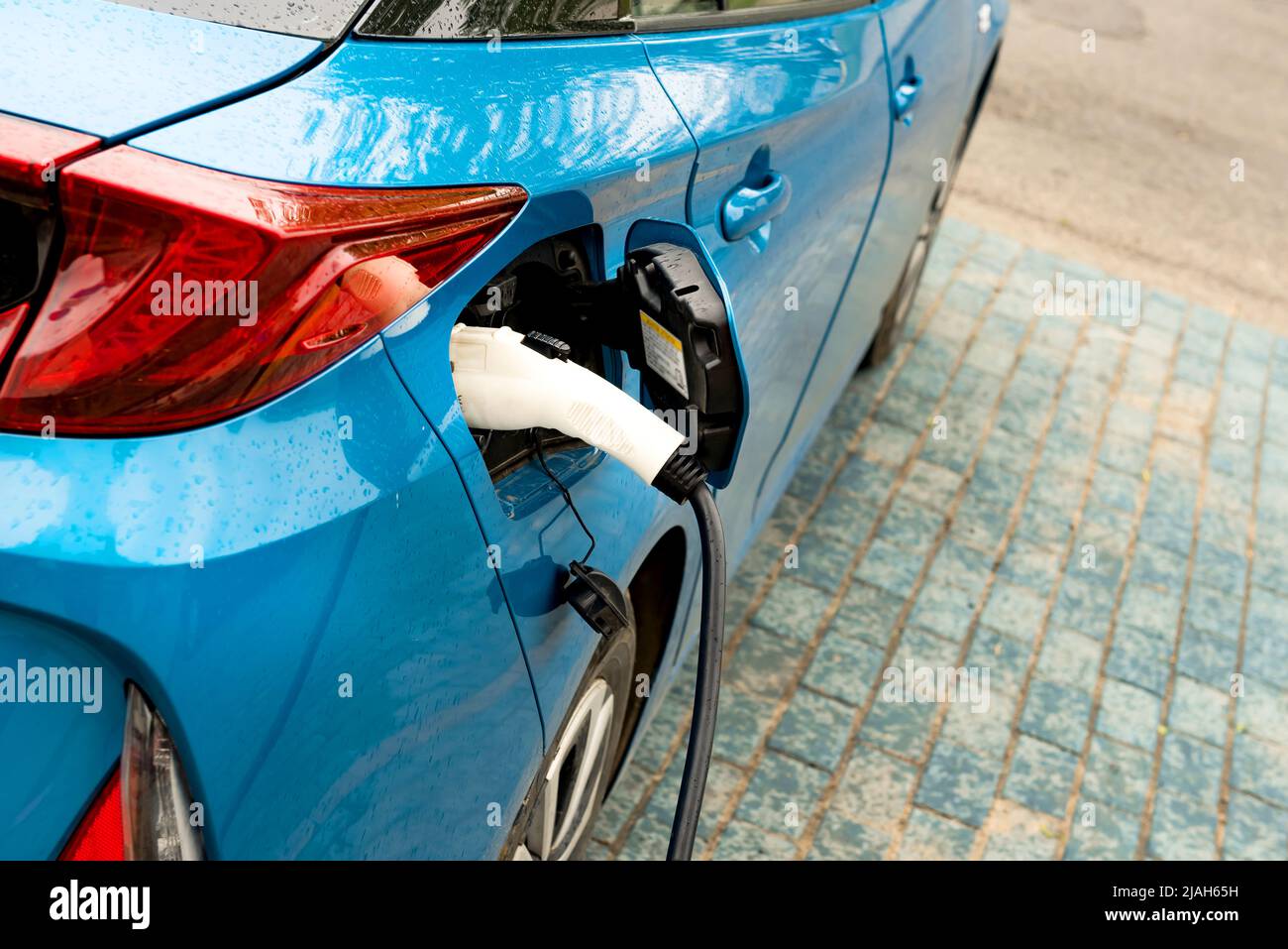 Electric car at the charging station. Ecology. Eco-friendly transport ...