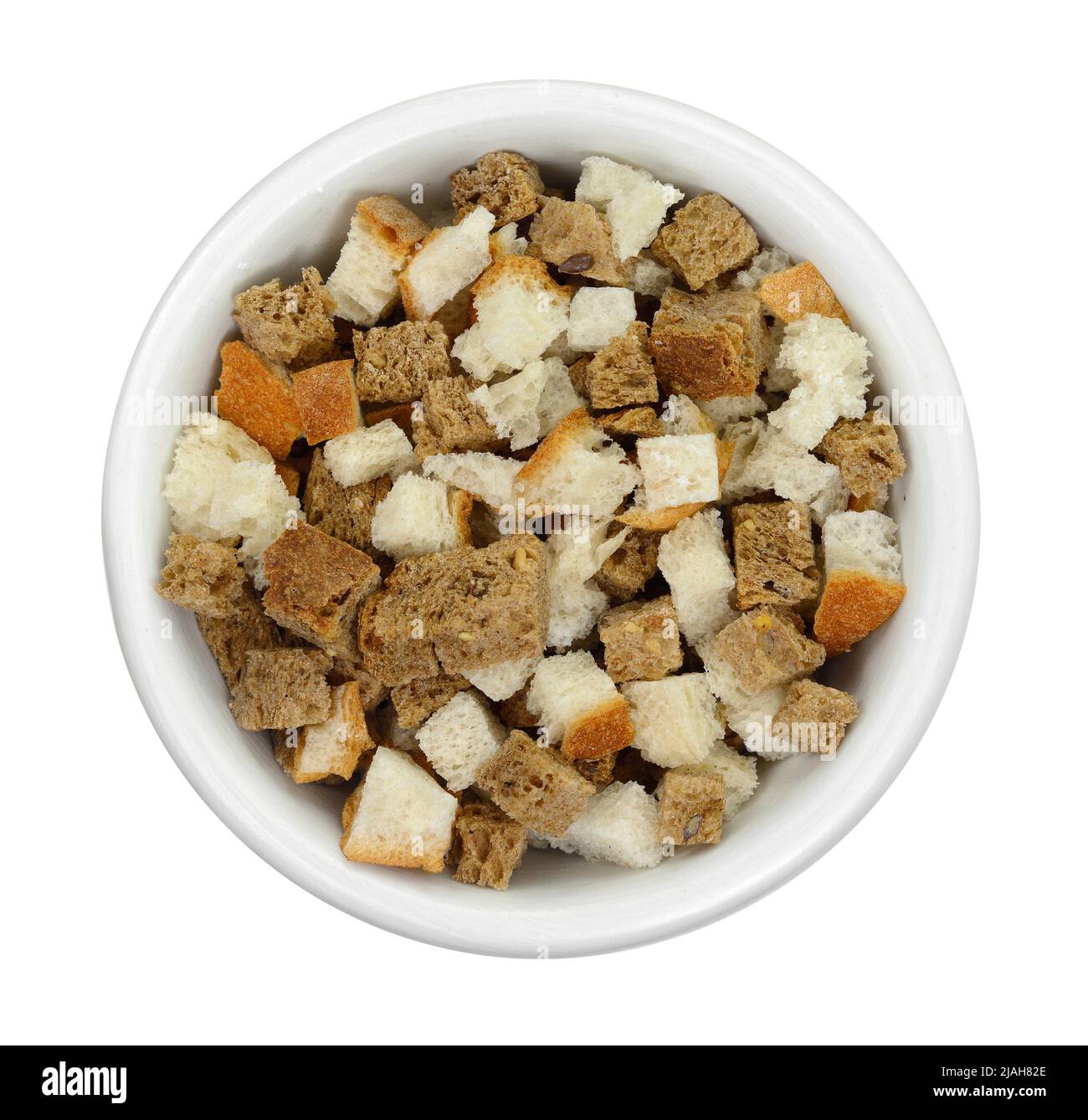 Bread croutons on a white background. Scattered pile of homemade rye