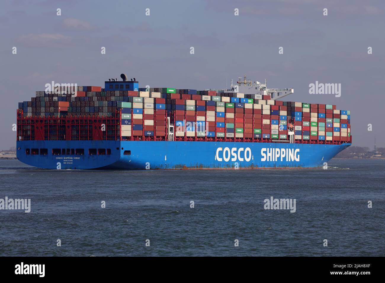 The container ship COSCO Shipping Virgo arrives in the port of Rotterdam on March 18, 2022. Stock Photo