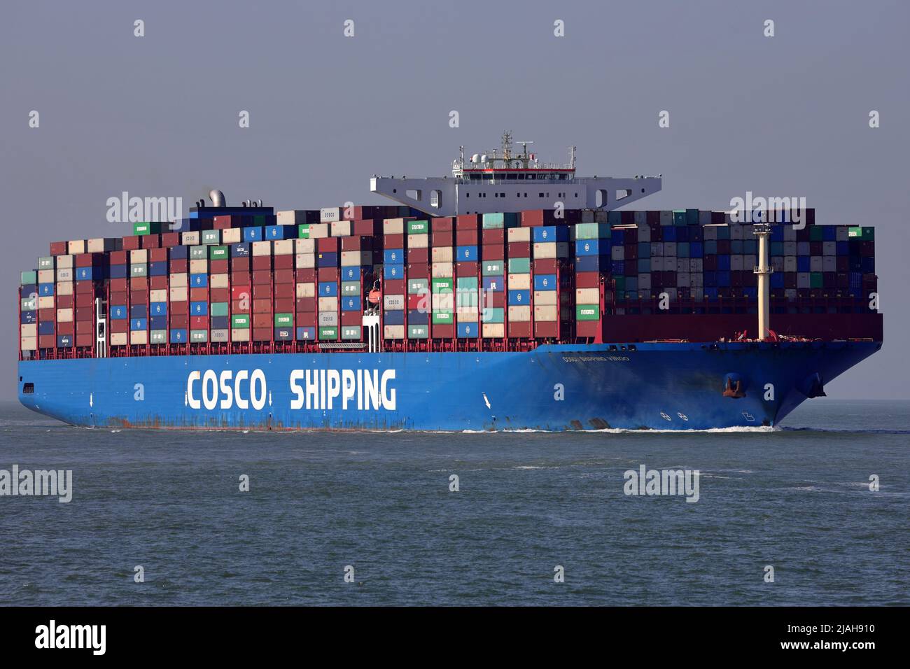The container ship COSCO Shipping Virgo arrives in the port of Rotterdam on March 18, 2022. Stock Photo