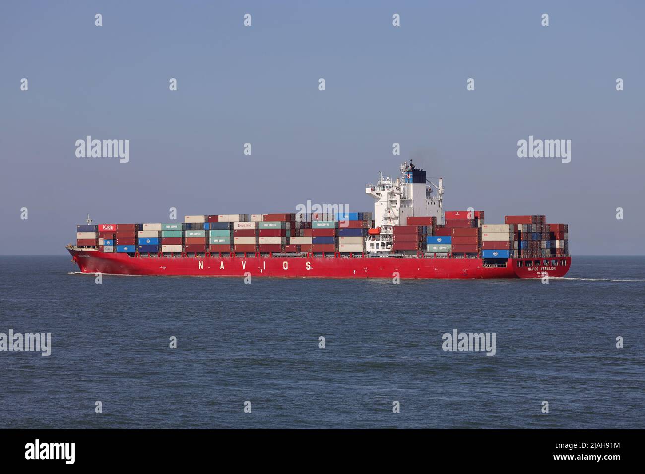 The container ship Navios Vermilion leaves the port of Rotterdam on March 18, 2022. Stock Photo