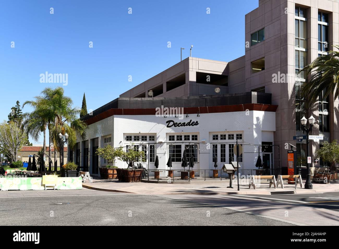 ANAHEIM, CALIFORNIA - 31 MAR 2021: Decades and Good Food dining establishments on the Center Street Promenade in the Ctr City downtown district. Stock Photo