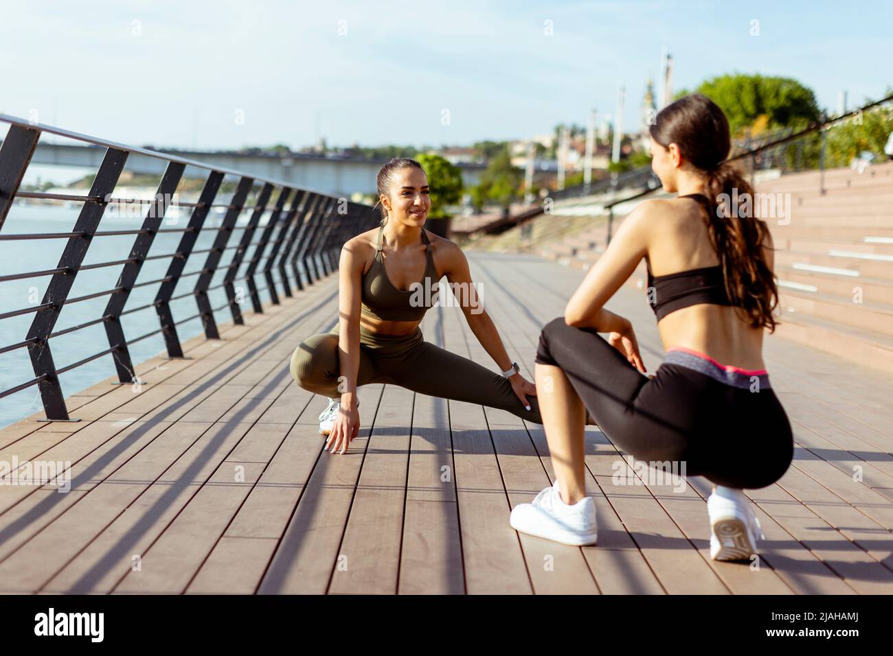 Two young women on waterfront hi-res stock photography and images - Alamy