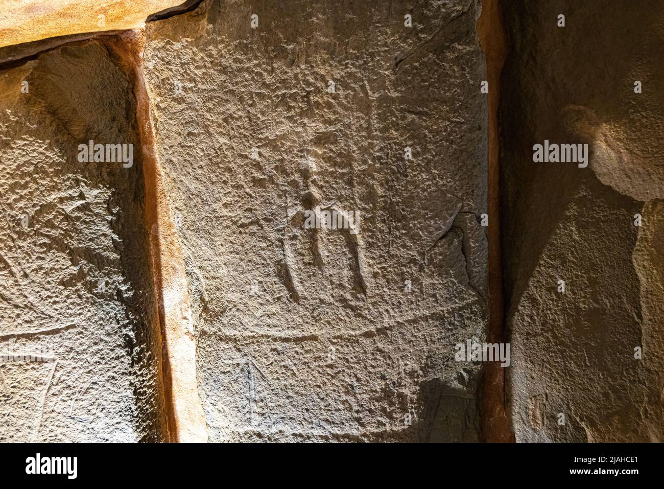 Artistic manifestation engraved in the stone in the megalithic monument of El dolmen de Soto Stock Photo