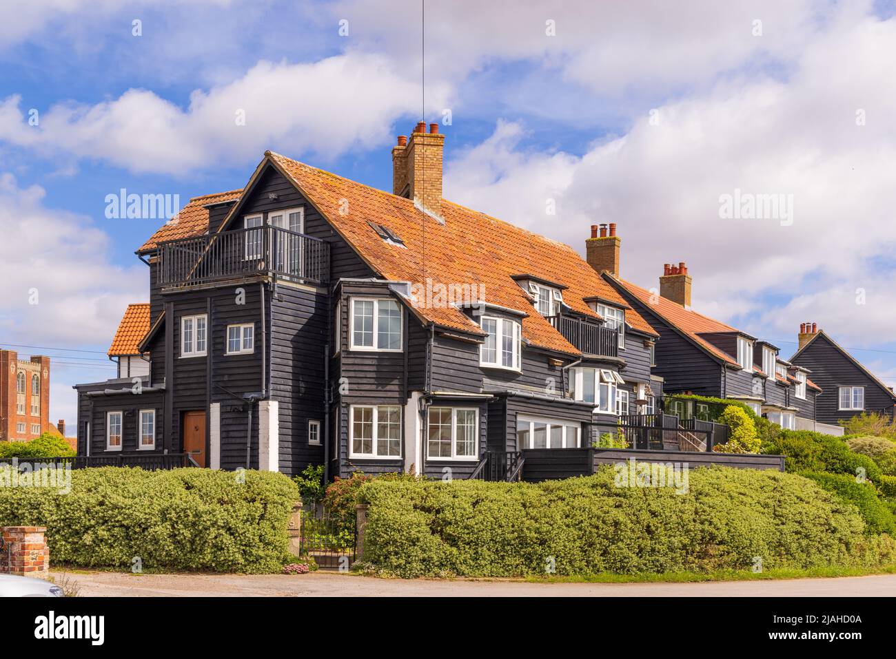 Attractive timber clad houses in the village of Thorpeness, Suffolk. UK Stock Photo