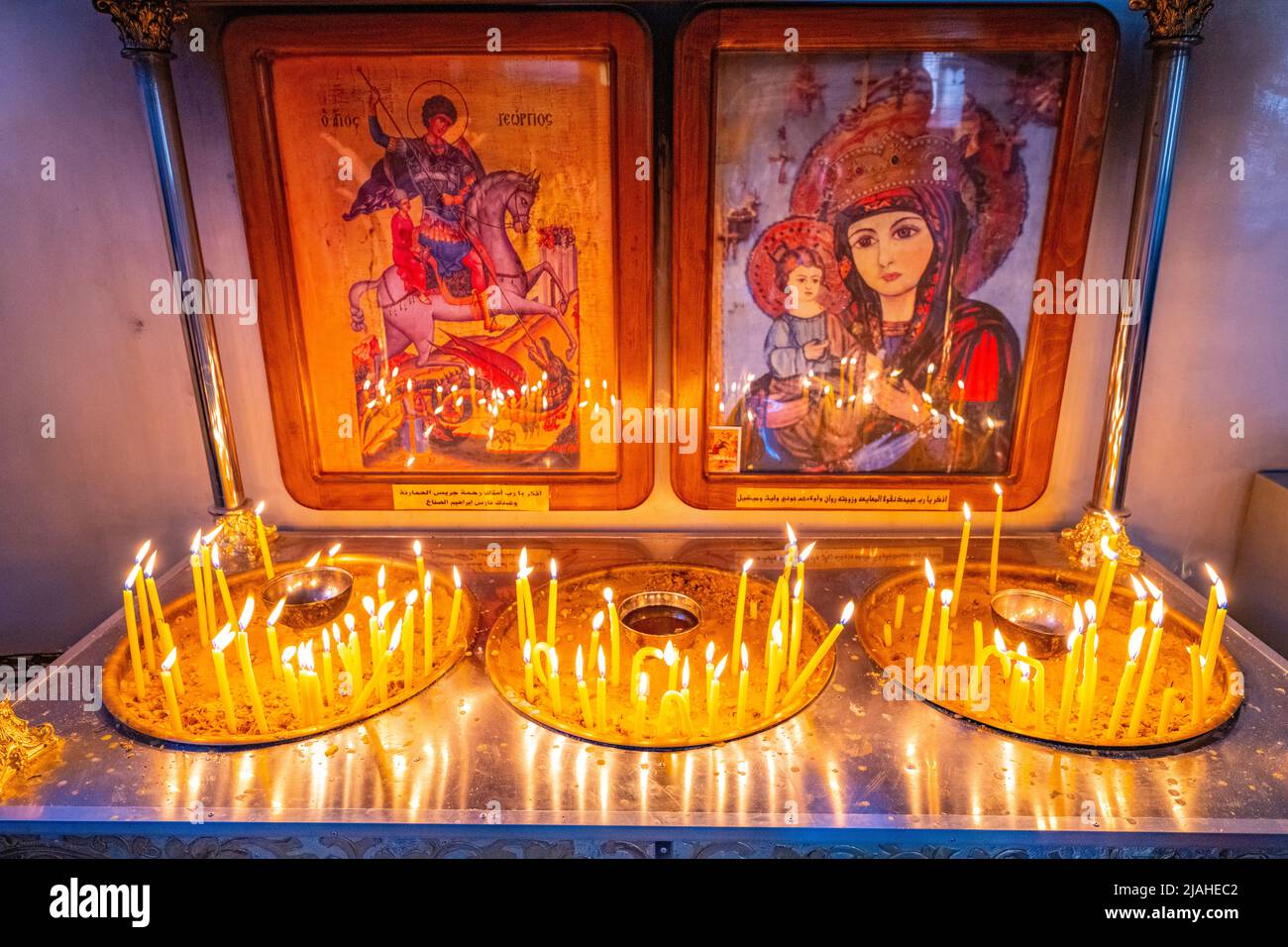 Candels in the Interior of the Greek Orthodox Basilica of Saint George Madaba. Home of the Madaba mosaic map Stock Photo