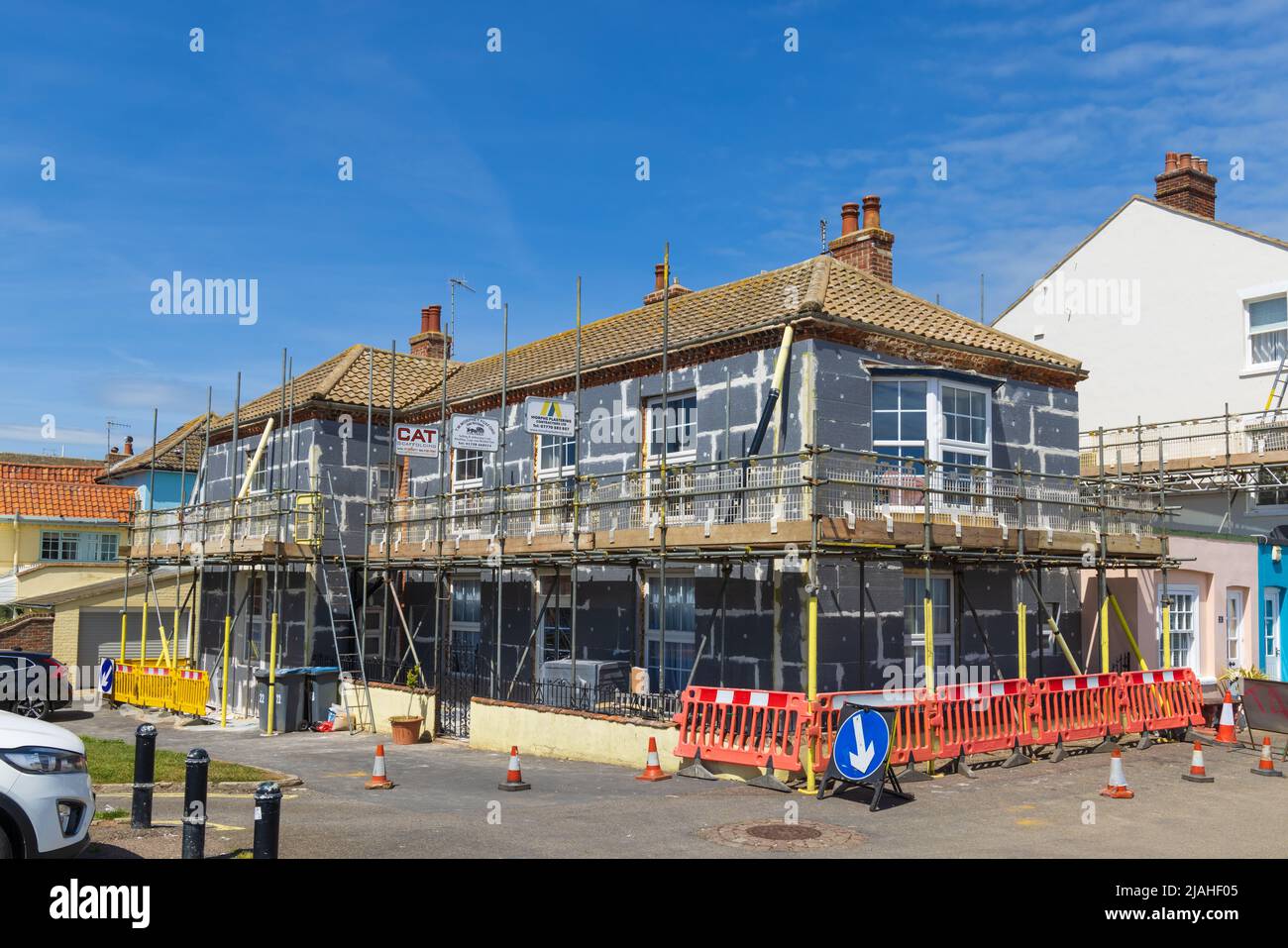 A house having external wall insulation applied to its facade.  Aldeburgh, Suffolk. UK. Stock Photo